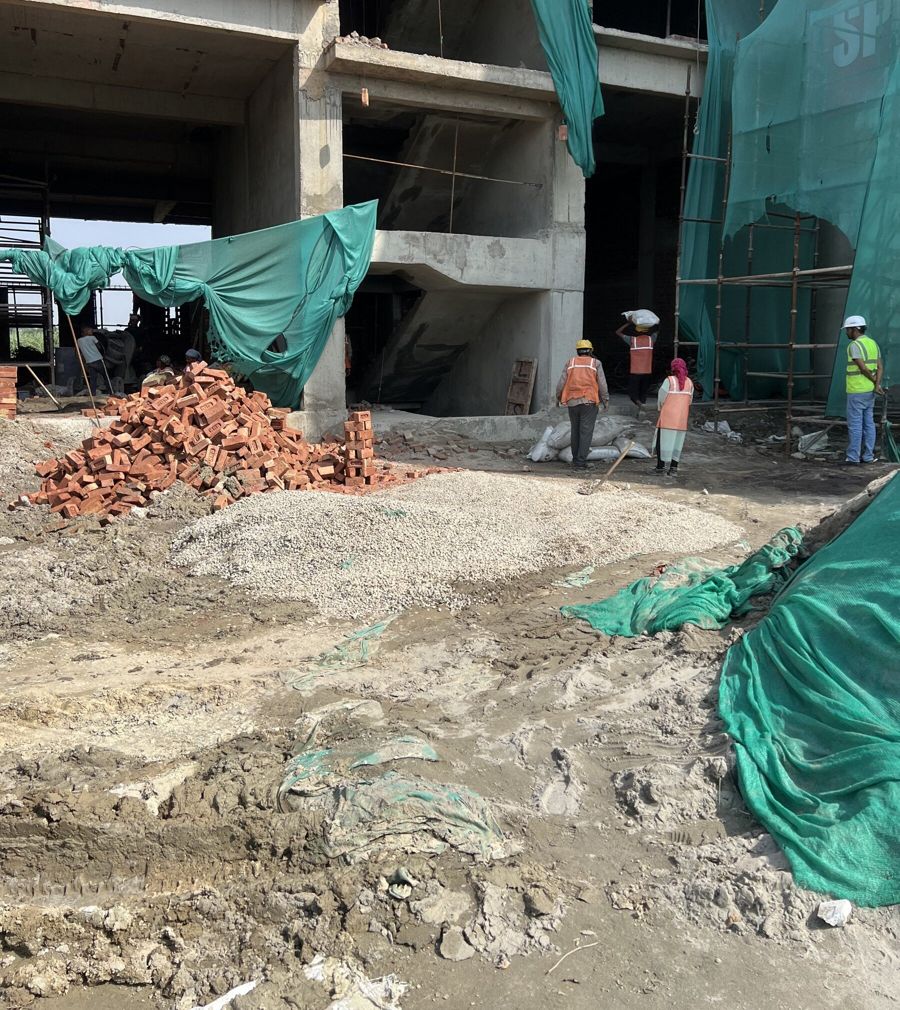 Concrete frame with work crews on site